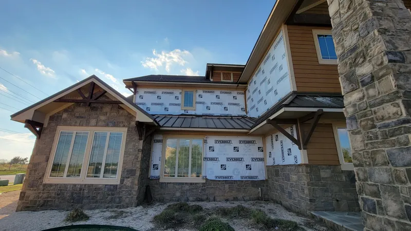 Home exterior siding wrap installation