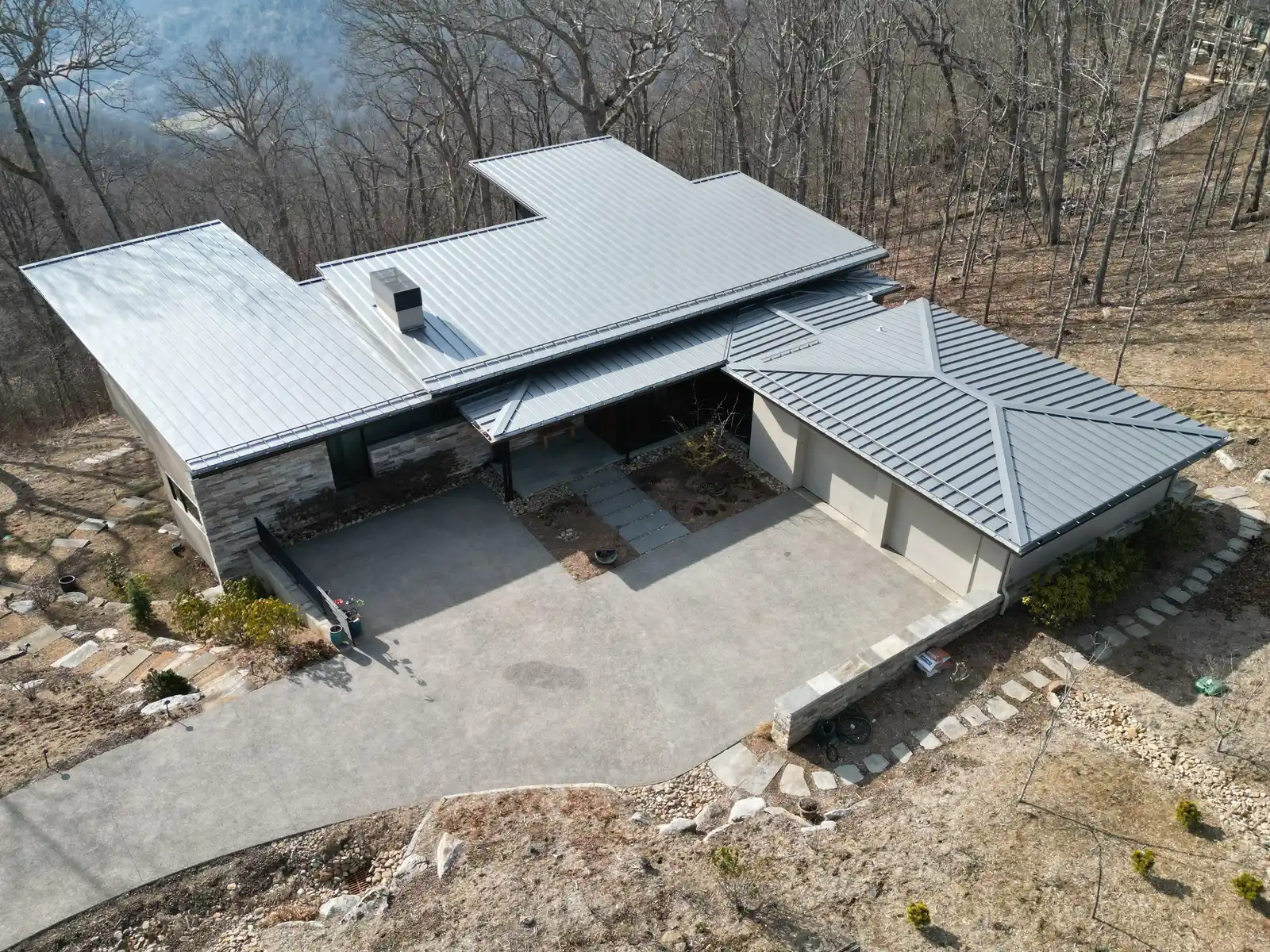 Modern home metal roof aerial view